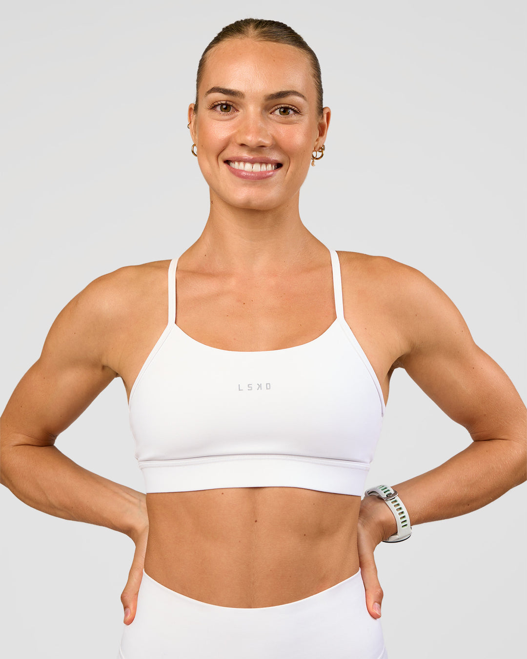 Woman wearing Lift Sports Bra - White | Model:Maja | Size:XS - view 1
