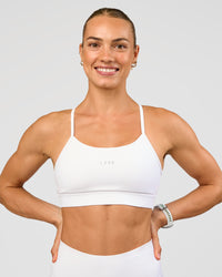Woman wearing Lift Sports Bra - White | Model:Maja | Size:XS | Thumbnail Index: 0