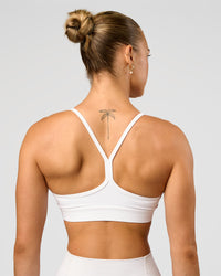 Woman wearing Lift Sports Bra - White | Model:Maja | Size:XS | Thumbnail Index: 1