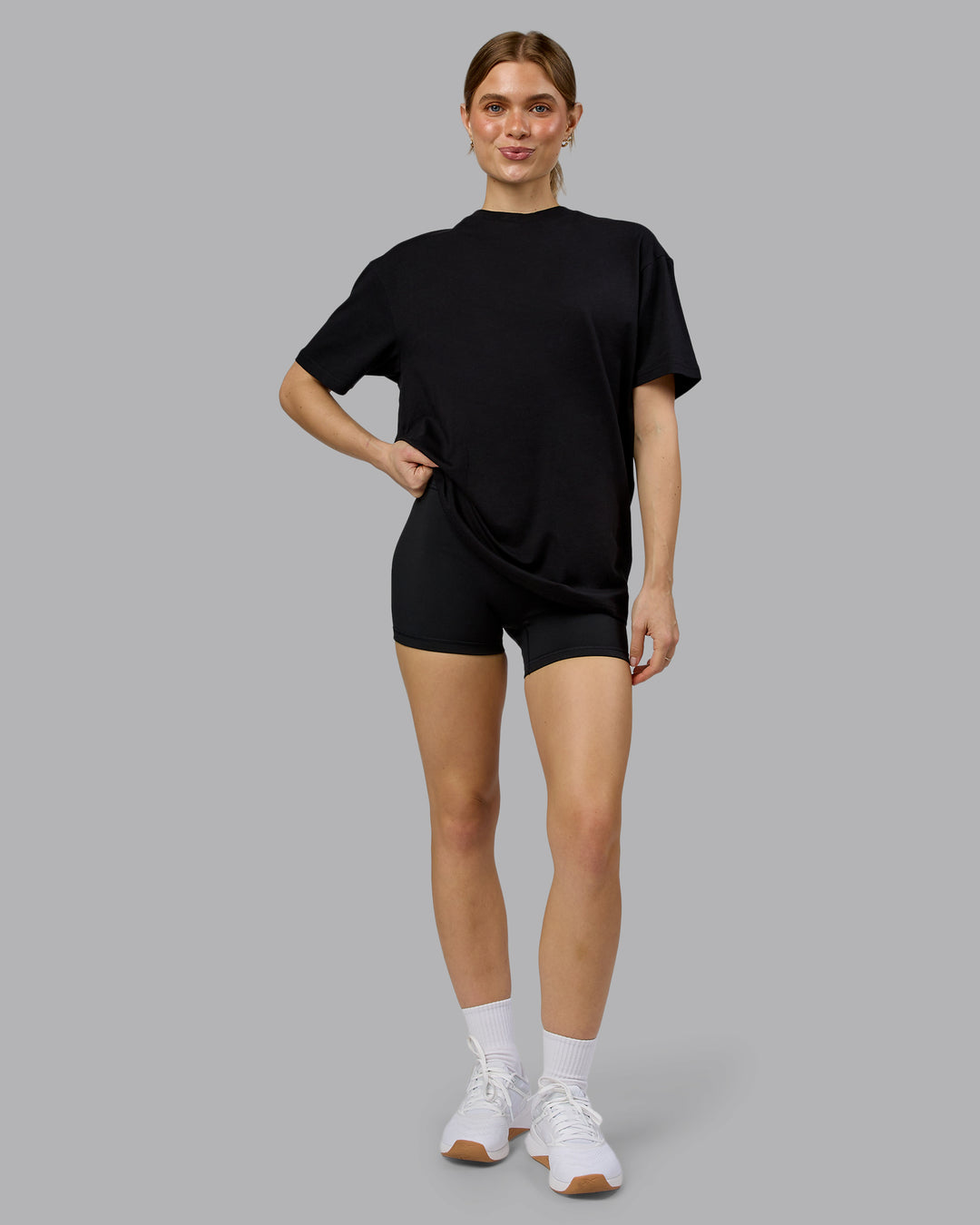 Woman wearing Lifting Club FLXCotton Tee Oversize - Black-Ultra Orange | Model:Emilie | Size:XS - view 6
