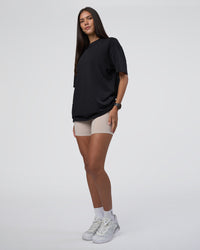 Woman wearing Lifting Club FLXCotton Tee Oversize - Black-Black | Model:Rhiley | Size:XS | Thumbnail Index: 10