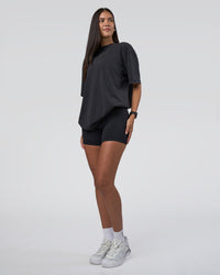 Woman wearing Lifting Club FLXCotton Tee Oversize - Black Washed | Model:Rhiley | Size:XS | Thumbnail Index: 6