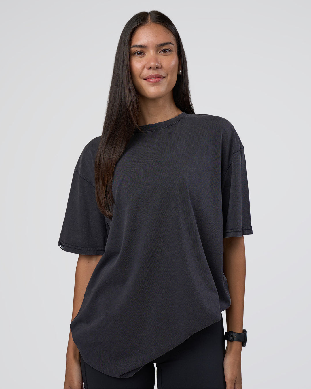 Woman wearing Lifting Club FLXCotton Tee Oversize - Black Washed | Model:Rhiley | Size:XS - view 4