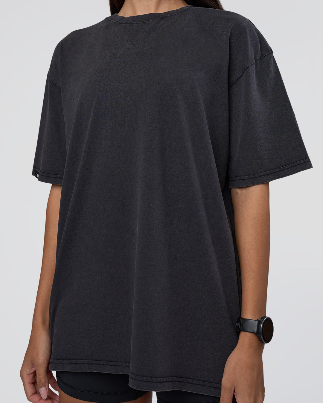Woman wearing Lifting Club FLXCotton Tee Oversize - Black Washed | Model:Rhiley | Size:XS - view 10