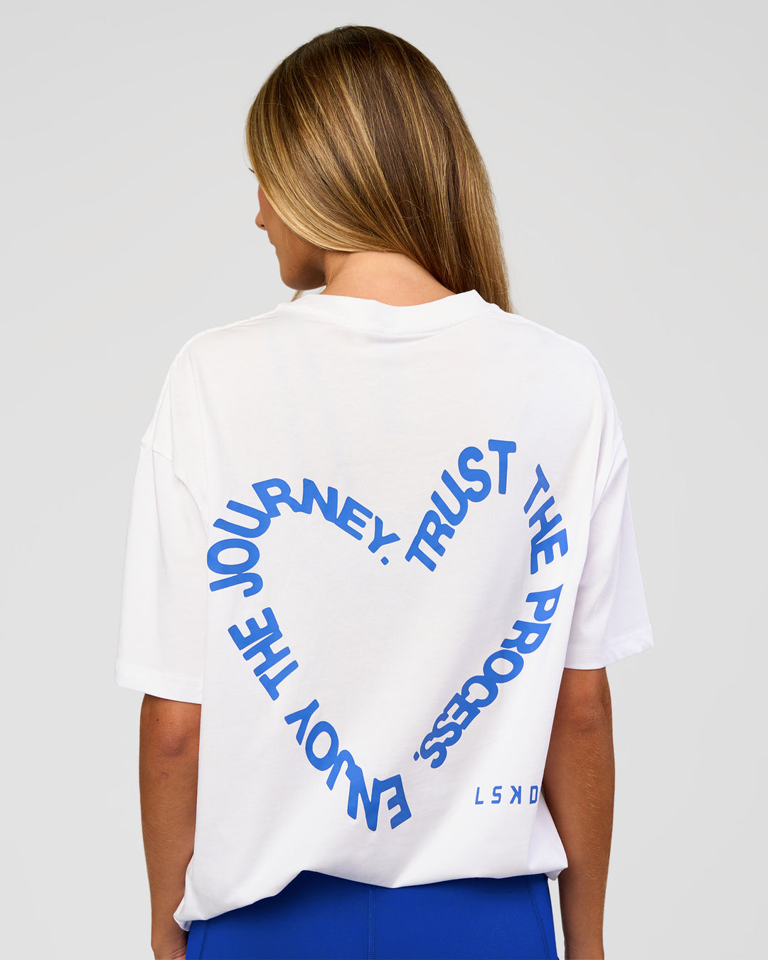 Woman wearing Love The Process FLXCotton Oversize Tee - White-Electric Indigo | Model:Georgia | Size:XS - view 4
