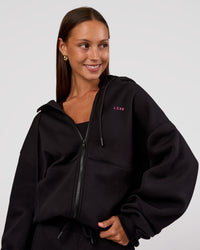 Woman wearing Love The Process Zip Through Hoodie - Black-Sugar Plum | Model:Brylee | Size:XS | Thumbnail Index: 1