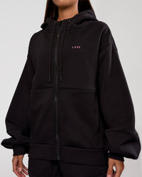 Woman wearing Love The Process Zip Through Hoodie - Black-Sugar Plum | Model:Brylee | Size:XS | Thumbnail Index: 3