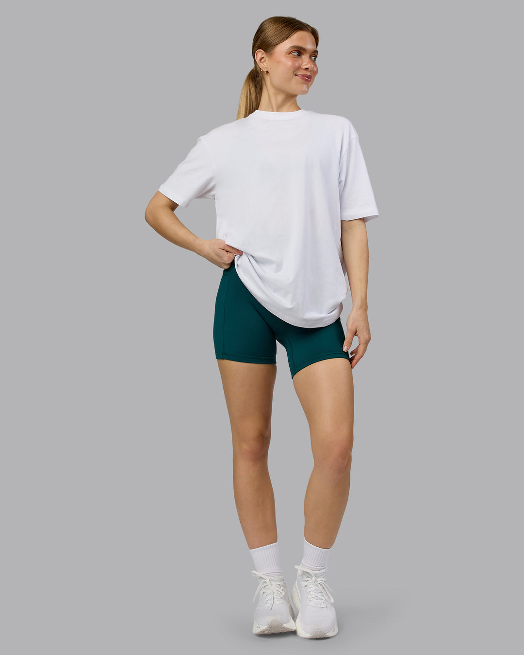 Woman wearing Love The Run FLXCotton Tee Oversize - White-Dark Moss | Model:Emilie | Size:XS - view 7