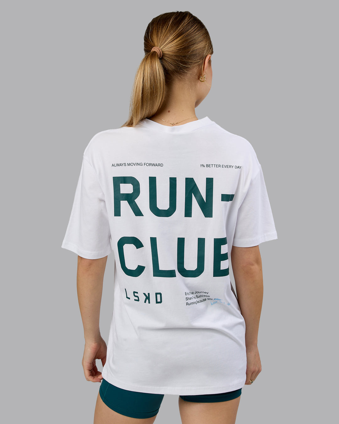 Woman wearing Love The Run FLXCotton Tee Oversize - White-Dark Moss | Model:Emilie | Size:XS - view 6
