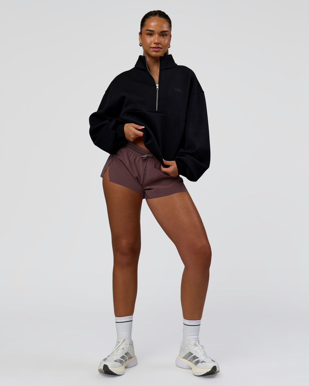 Woman wearing Luxe ZeroCrease Spacer Half Zip - Black | Model:Sophia | Size:XS - view 3