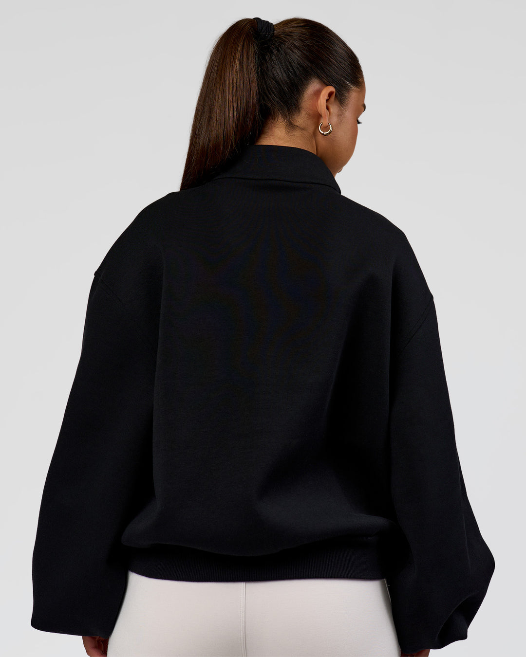 Woman wearing Luxe ZeroCrease Spacer Half Zip - Black | Model:Sophia | Size:XS - view 5