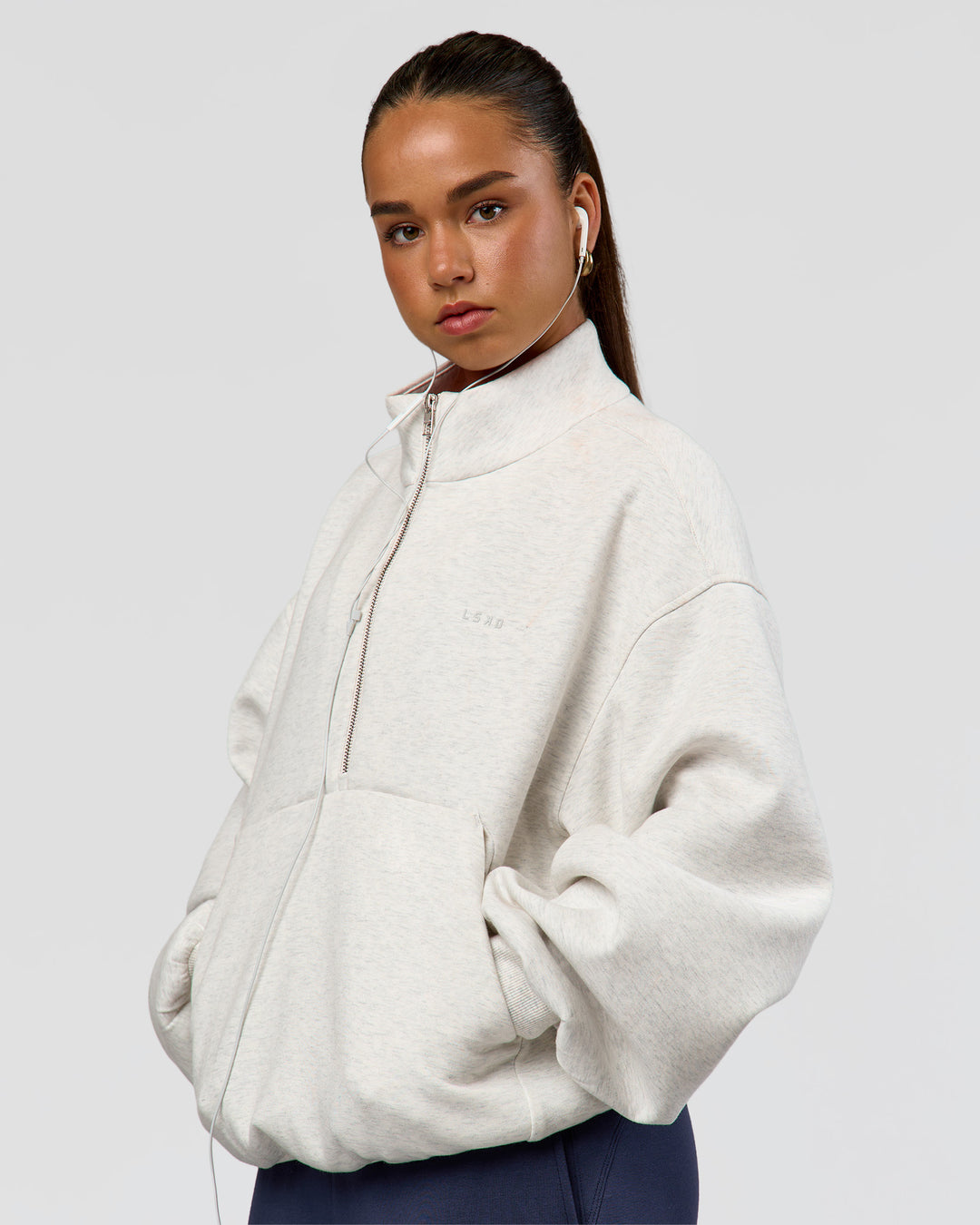 Woman wearing Luxe ZeroCrease Spacer Half Zip - Silver Marl | Model:Sophia | Size:XS - view 6