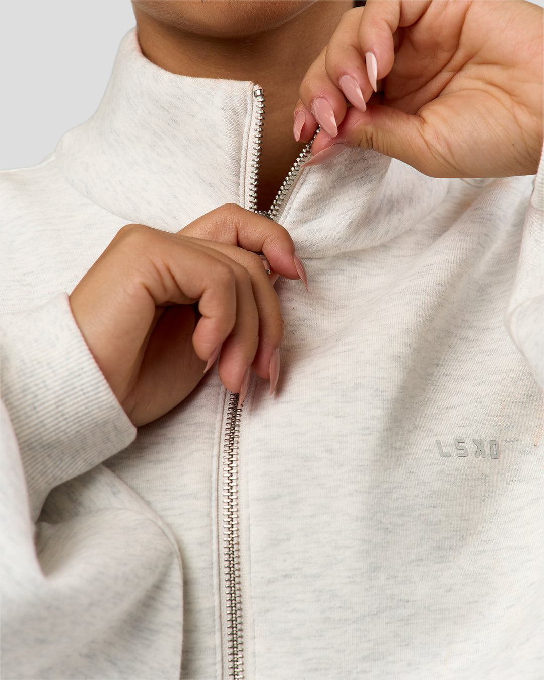 Woman wearing Luxe ZeroCrease Spacer Half Zip - Silver Marl | Model:Sophia | Size:XS - view 2