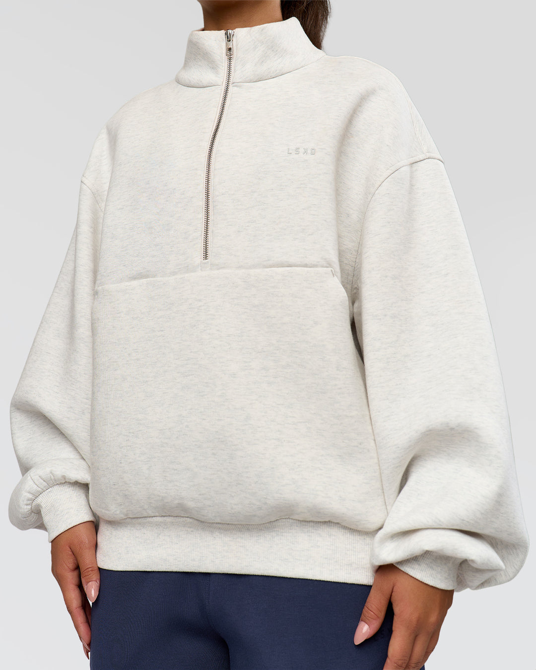 Woman wearing Luxe ZeroCrease Spacer Half Zip - Silver Marl | Model:Sophia | Size:XS - view 8