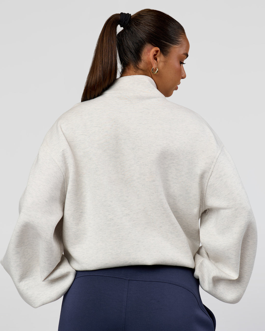 Woman wearing Luxe ZeroCrease Spacer Half Zip - Silver Marl | Model:Sophia | Size:XS - view 3