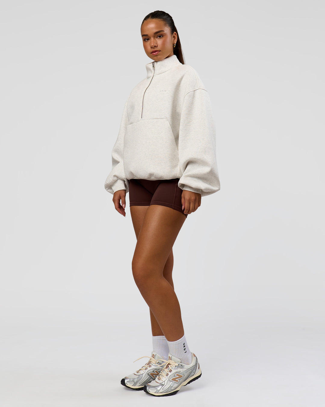 Woman wearing Luxe ZeroCrease Spacer Half Zip - Silver Marl | Model:Sophia | Size:XS - view 10