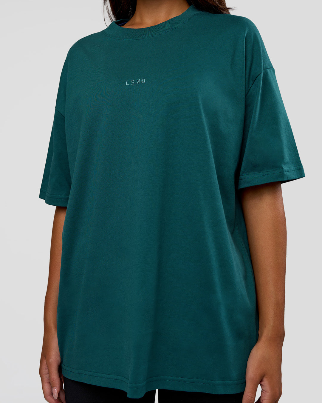 Woman wearing MVP 2.0 Oversized Tee - Transformative Teal | Model:Kirstyn | Size:XS - view 11