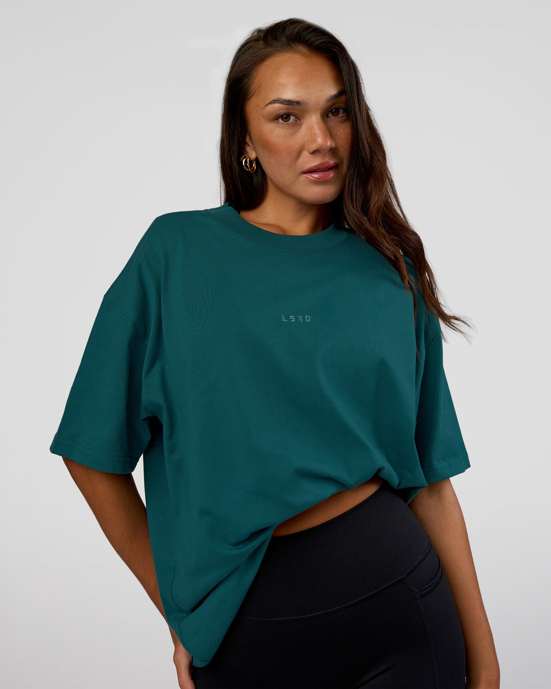 Woman wearing MVP 2.0 Oversized Tee - Transformative Teal | Model:Kirstyn | Size:XS - view 4