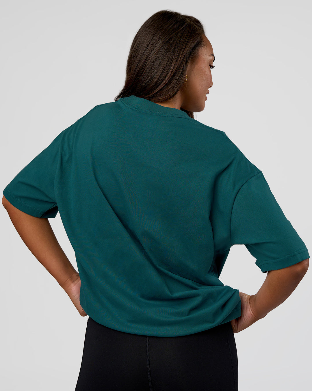 Woman wearing MVP 2.0 Oversized Tee - Transformative Teal | Model:Kirstyn | Size:XS - view 7