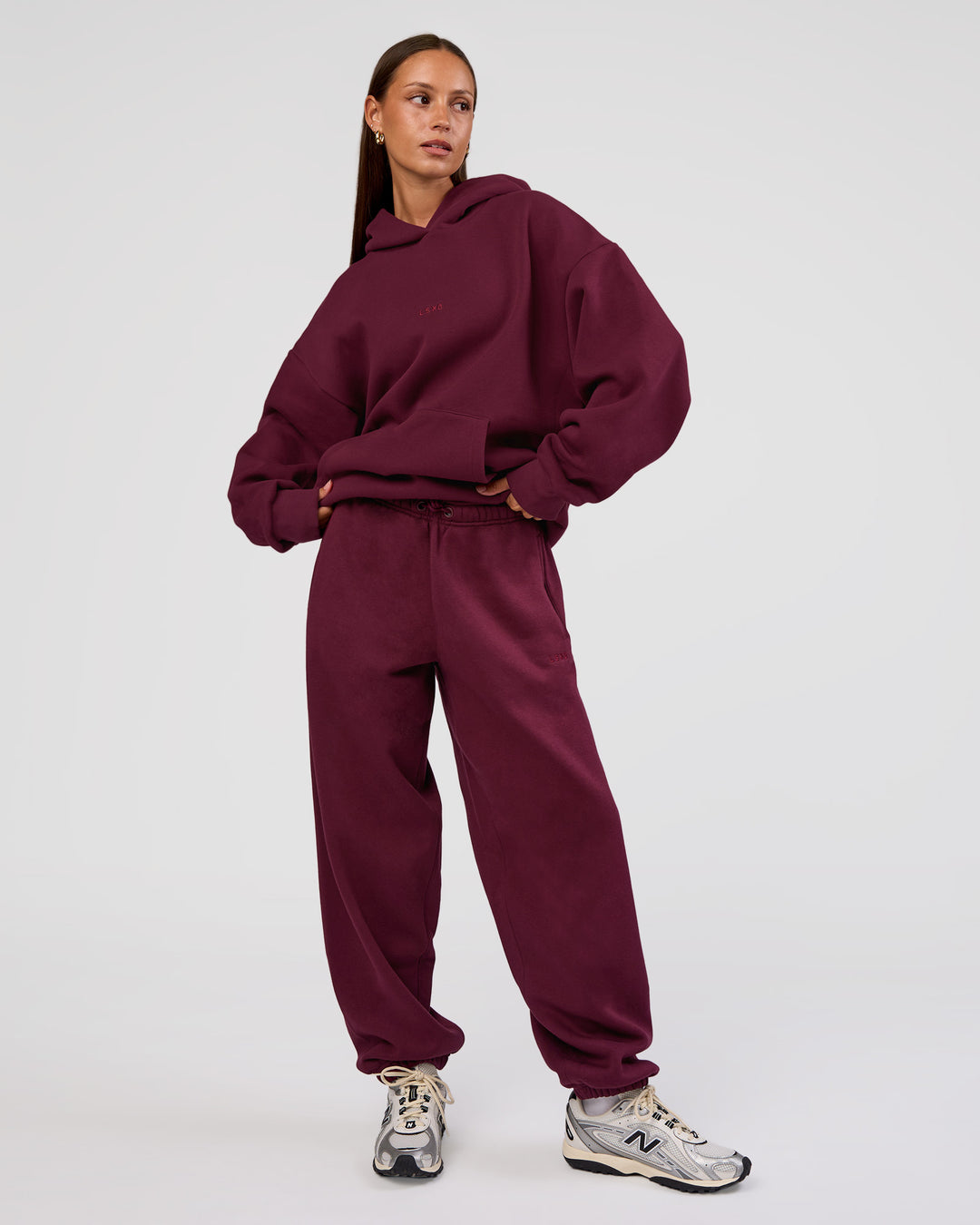 Woman wearing MVP Oversized Hoodie - Cherry Lacquer | Model:Brylee | Size:XS - view 3