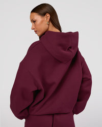 Woman wearing MVP Oversized Hoodie - Cherry Lacquer | Model:Brylee | Size:XS | Thumbnail Index: 5