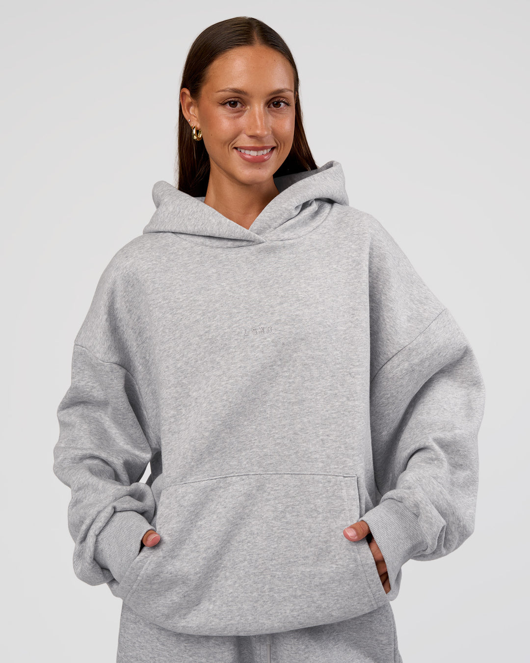 Woman wearing MVP Oversized Hoodie - Light Grey Marl | Model:Brylee | Size:XS - view 3