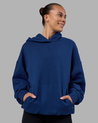 Woman wearing MVP Oversized Hoodie - Midnight Blue | Model:Charlize | Size:XS | Thumbnail Index: 2
