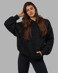 Woman wearing MVP Quilted Oversized Hoodie - Black-Geometric | Model:Phoebe | Size:XS | Thumbnail Index: 5