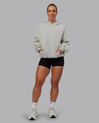 Woman wearing MVP Quilted Oversized Hoodie - Digital Mist-Geometric | Model:Lyss | Size:XS | Thumbnail Index: 5