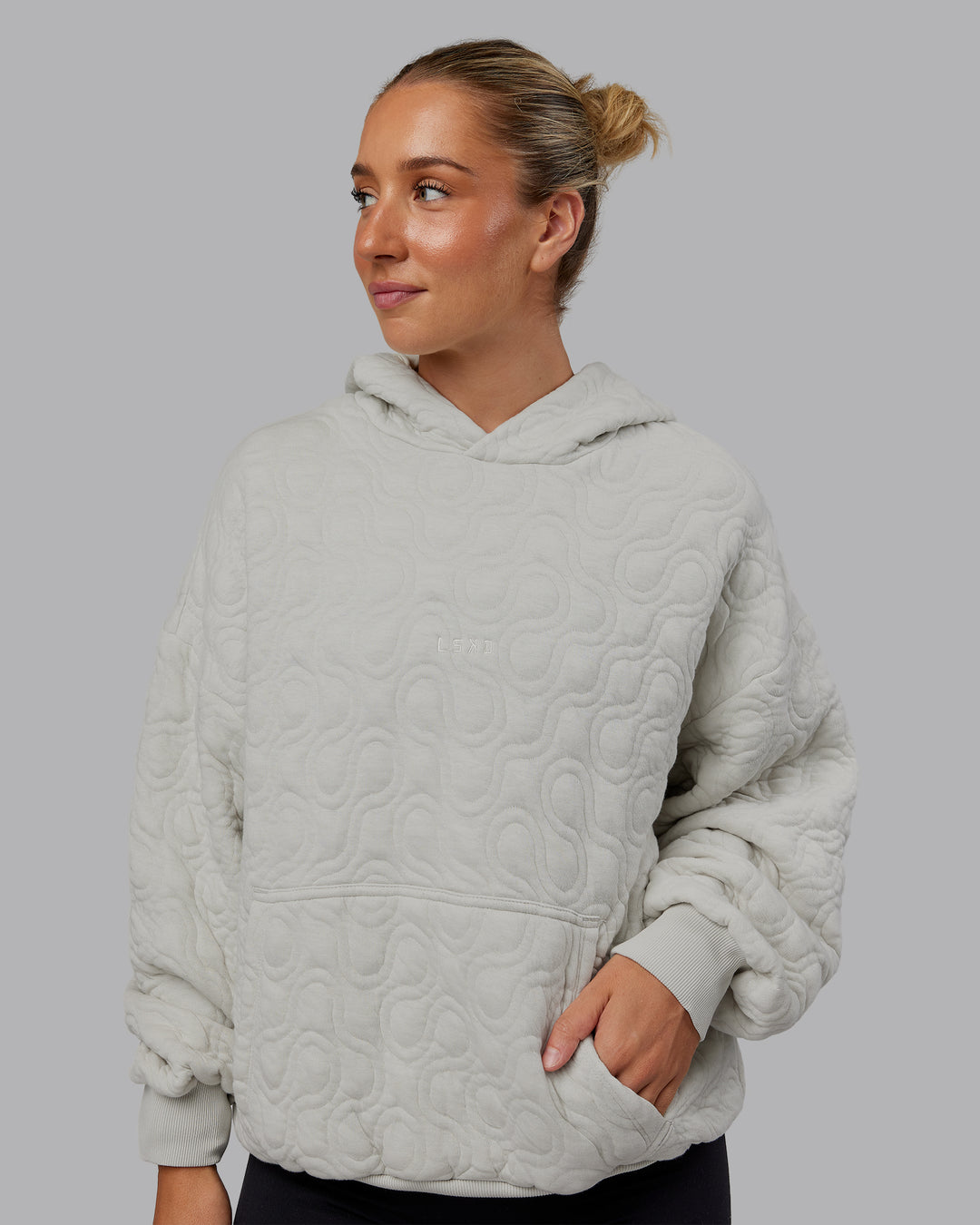 Woman wearing MVP Quilted Oversized Hoodie - Digital Mist-Geometric | Model:Lyss | Size:XS - view 3