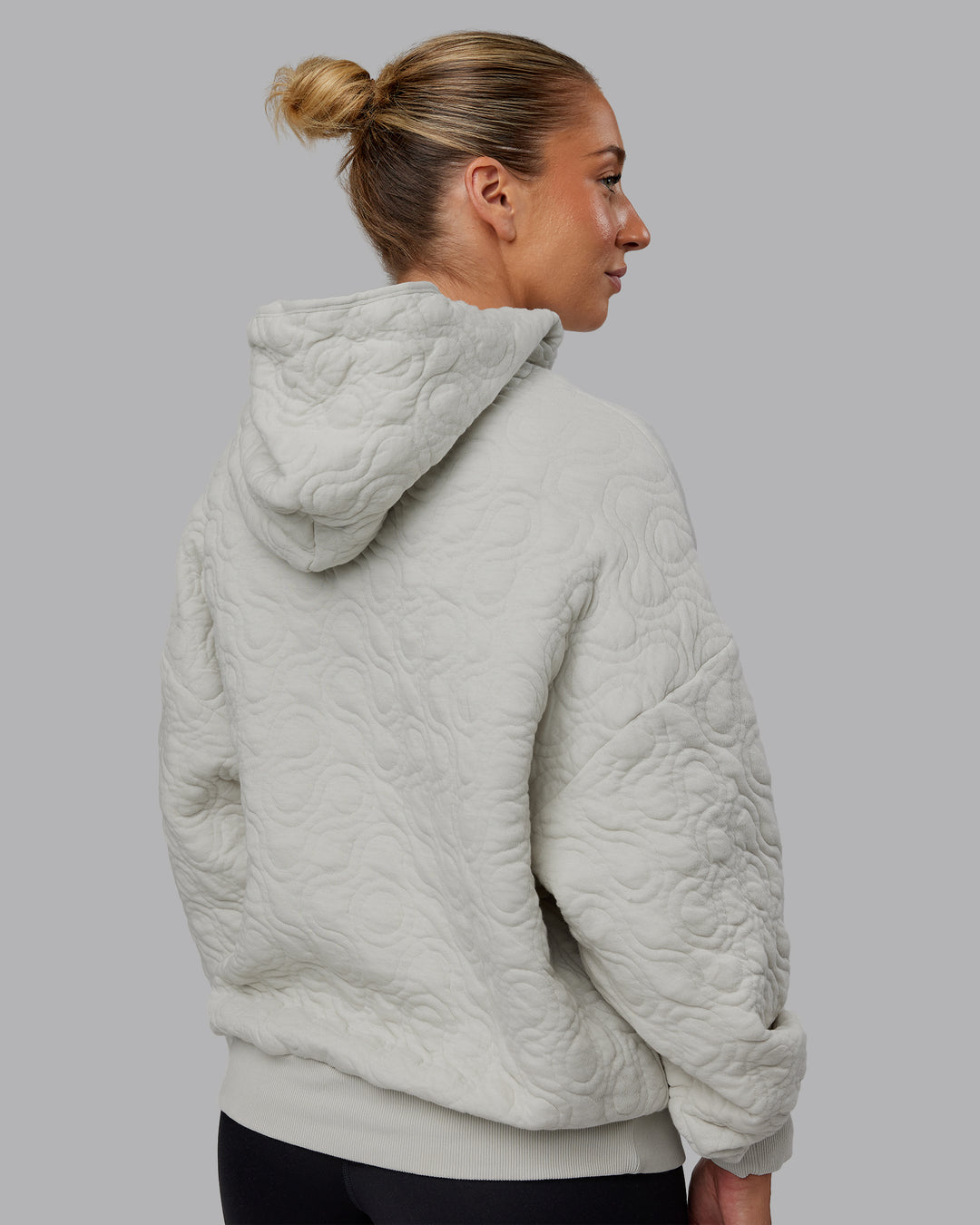 Woman wearing MVP Quilted Oversized Hoodie - Digital Mist-Geometric | Model:Lyss | Size:XS - view 4