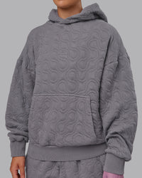 Woman wearing MVP Quilted Oversized Hoodie - Storm Front-Geometric | Model:Lyss | Size:XS | Thumbnail Index: 8