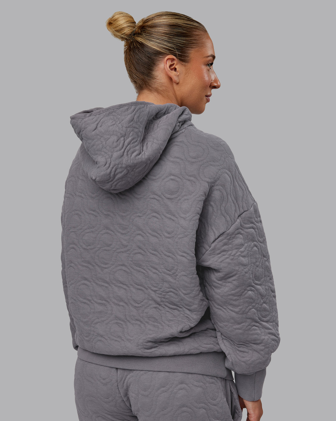 Woman wearing MVP Quilted Oversized Hoodie - Storm Front-Geometric | Model:Lyss | Size:XS - view 10
