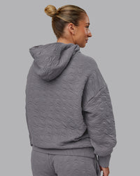 Woman wearing MVP Quilted Oversized Hoodie - Storm Front-Geometric | Model:Lyss | Size:XS | Thumbnail Index: 9