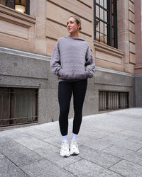 Woman wearing MVP Quilted Oversized Hoodie - Storm Front-Geometric | Model:Paris | Size:XS | Thumbnail Index: 1