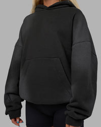 Woman wearing Memory In Motion 500gsm Ultra Heavyweight Washed Hoodie - Charcoal Washed | Model:Alex | Size:XS | Thumbnail Index: 18