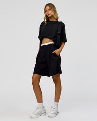 Woman wearing Memory in Motion Heavyweight Oversized Tee - Black Washed | Model:Leilani | Size:XS | Thumbnail Index: 9