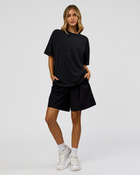 Woman wearing Memory in Motion Heavyweight Oversized Tee - Black Washed | Model:Leilani | Size:XS | Thumbnail Index: 10