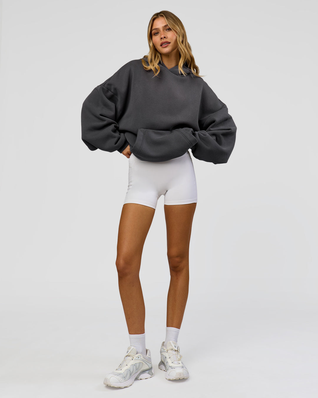 Woman wearing Memory In Motion Ultra Heavyweight Washed Hoodie - Dark Storm Washed | Model:Leilani | Size:XS - view 13