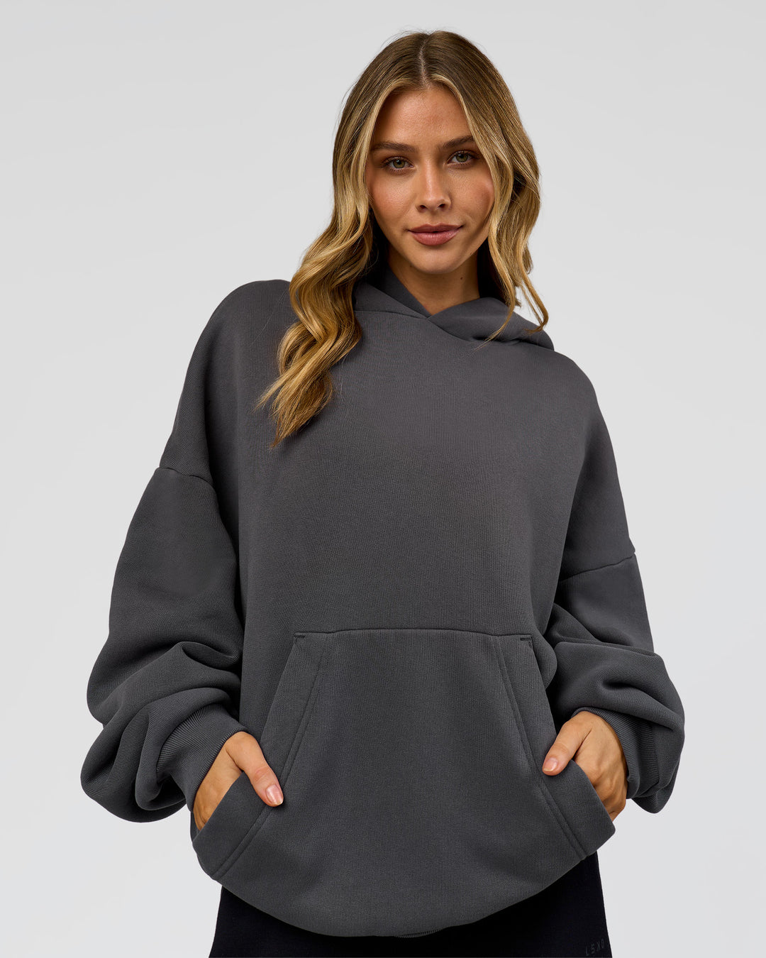 Woman wearing Memory In Motion Ultra Heavyweight Washed Hoodie - Dark Storm Washed | Model:Leilani | Size:XS - view 5