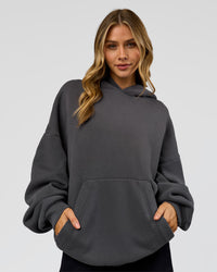 Woman wearing Memory In Motion Ultra Heavyweight Washed Hoodie - Dark Storm Washed | Model:Leilani | Size:XS | Thumbnail Index: 4