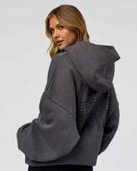 Woman wearing Memory In Motion Ultra Heavyweight Washed Hoodie - Dark Storm Washed | Model:Leilani | Size:XS | Thumbnail Index: 3