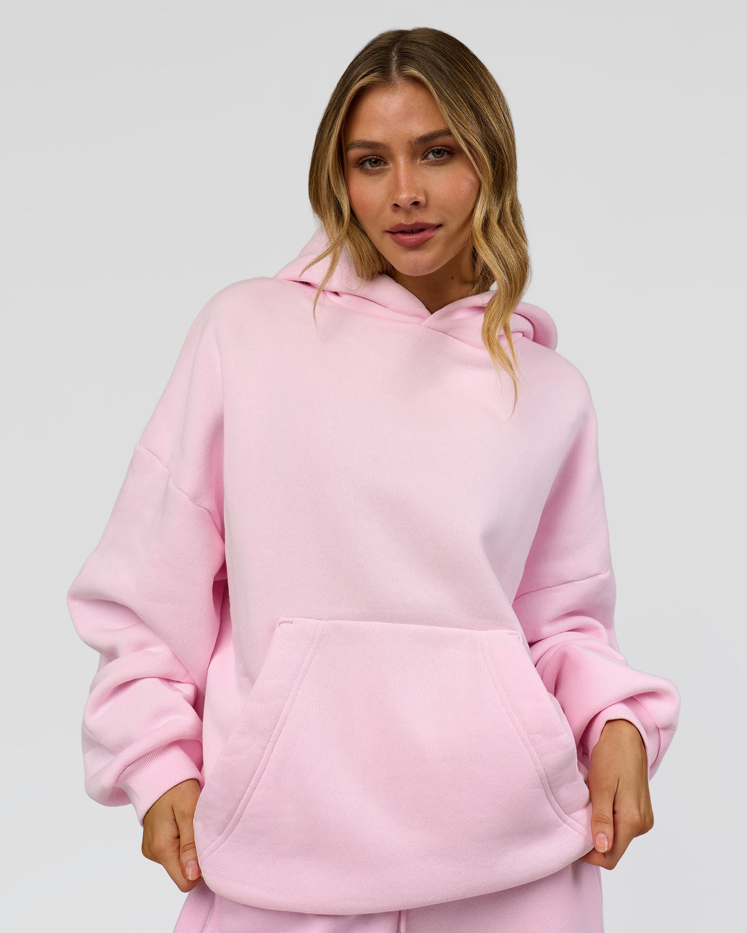Woman wearing Memory In Motion Ultra Heavyweight Washed Hoodie - Marshmallow Washed | Model:Leilani | Size:XS - view 4