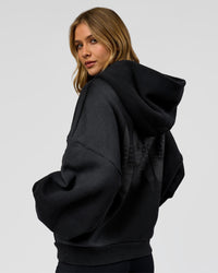 Woman wearing Memory in Motion Ultra Heavyweight Zip Thru Hoodie - Black Washed | Model:Leilani | Size:XS | Thumbnail Index: 4