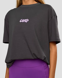 Woman wearing Miami Snatch FLXCotton Oversized Tee - Dark Storm-Marshmallow | Model:Georgia | Size:XS | Thumbnail Index: 10