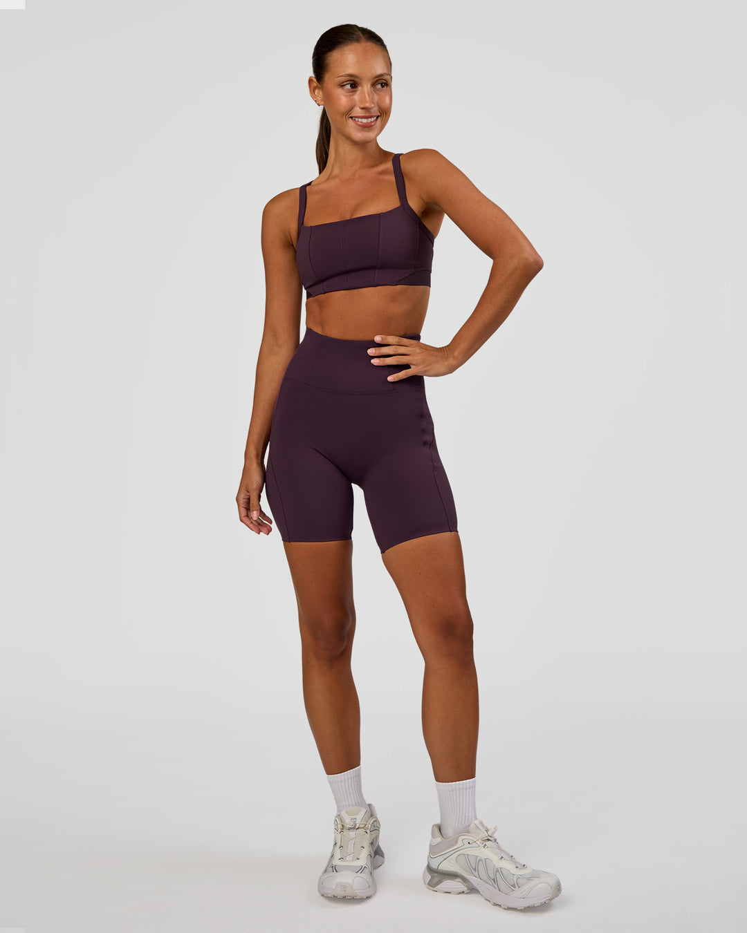 Woman wearing Momentum Corset Sports Bra - Midnight Plum | Model:Brylee | Size:XS - view 6