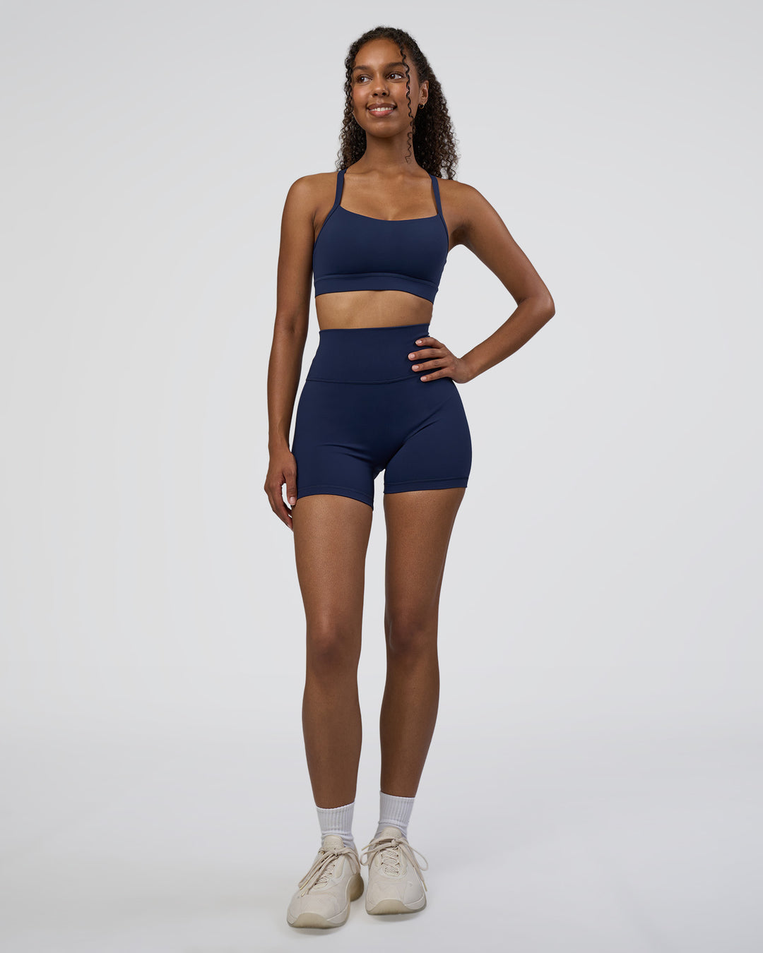 Woman wearing Momentum Sports Bra D/DD/E - Future Navy | Model:Jordan | Size:XS - view 3