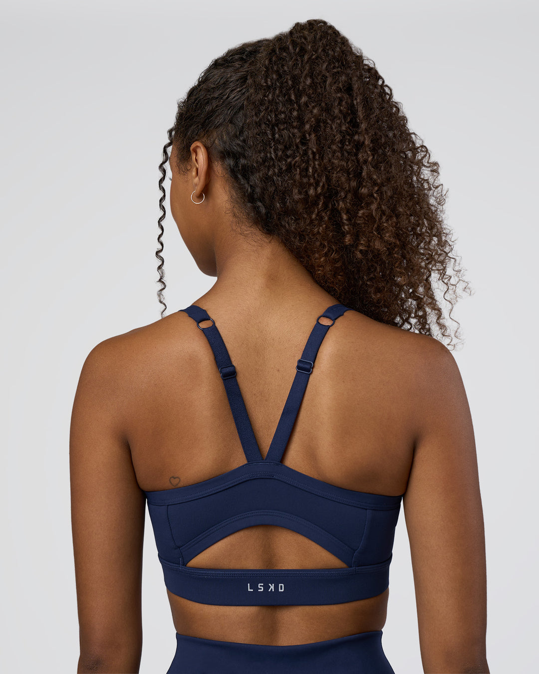 Woman wearing Momentum Sports Bra D/DD/E - Future Navy | Model:Jordan | Size:XS - view 2