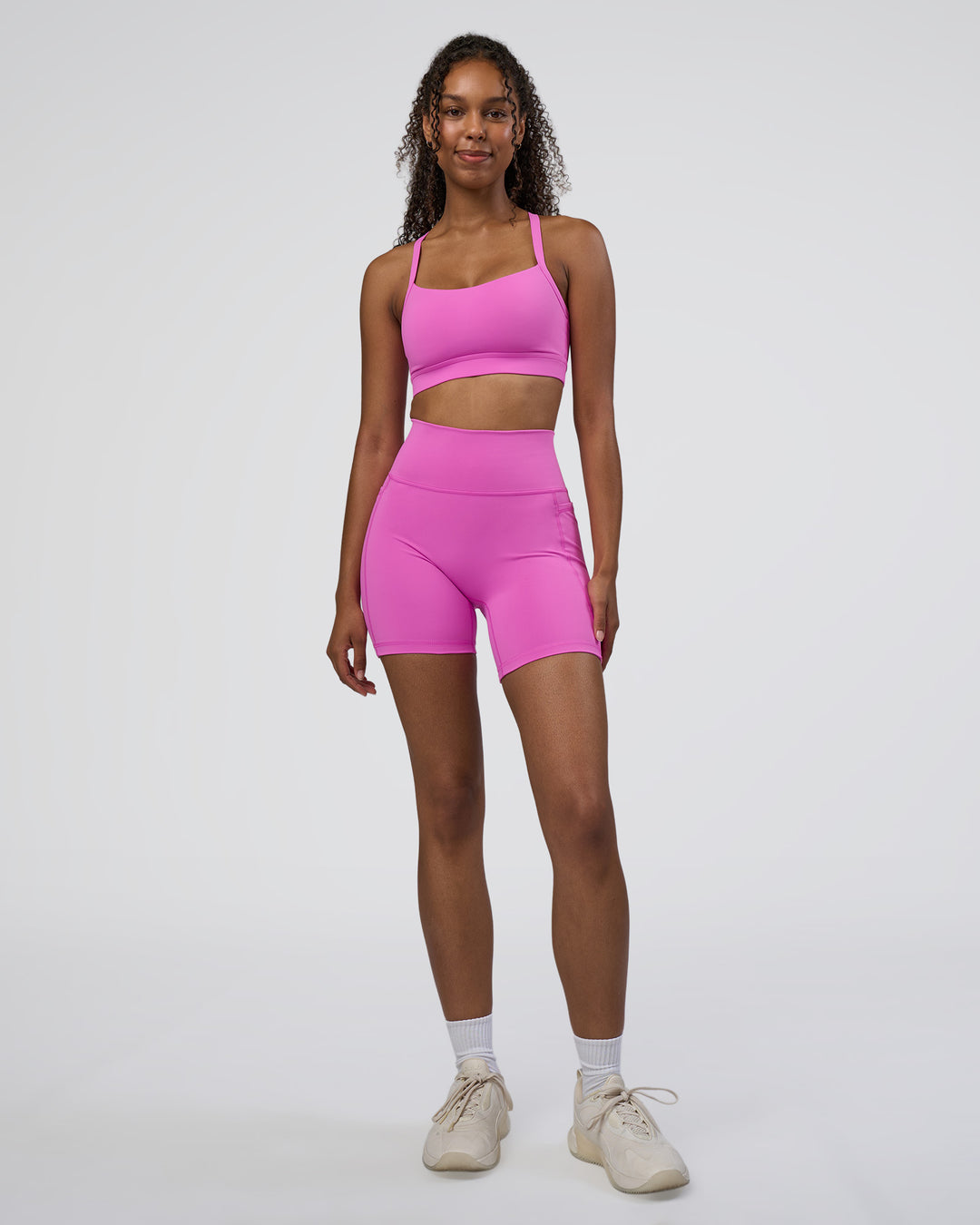 Woman wearing Momentum Sports Bra D/DD/E - Ultra Fuchsia | Model:Jordan | Size:XS - view 3