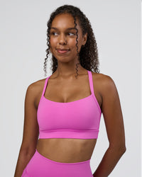 Woman wearing Momentum Sports Bra D/DD/E - Ultra Fuchsia | Model:Jordan | Size:XS | Thumbnail Index: 0